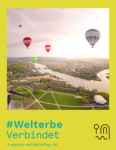 Fotowettbewerb #WelterbeVerbindet 2026 Platz 1 Blick auf Koblenz über die Festung Ehrenbreitstein mit aufsteigenden Heißluftballons